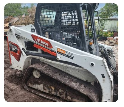 904Tree Bobcat skid steer loader working a job site in Jacksonville, FL